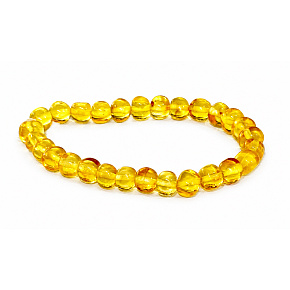 Amber Baltic golden shining, natural elastic bracelet, irregular nugget approx. 5 mm / 16 - 17 cm, solidified sunlight